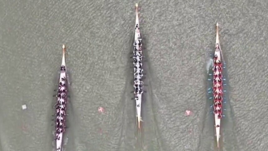 飞桨逐浪战汨罗 三湘儿女竞风流